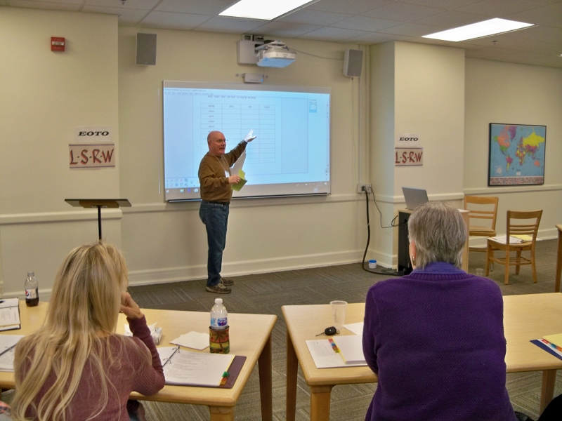 Ed Lee demonstrates smart board use to new tutors